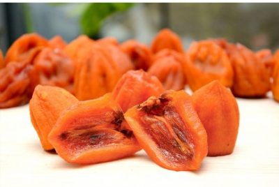 Half dried persimmons – juicy and creamy texture